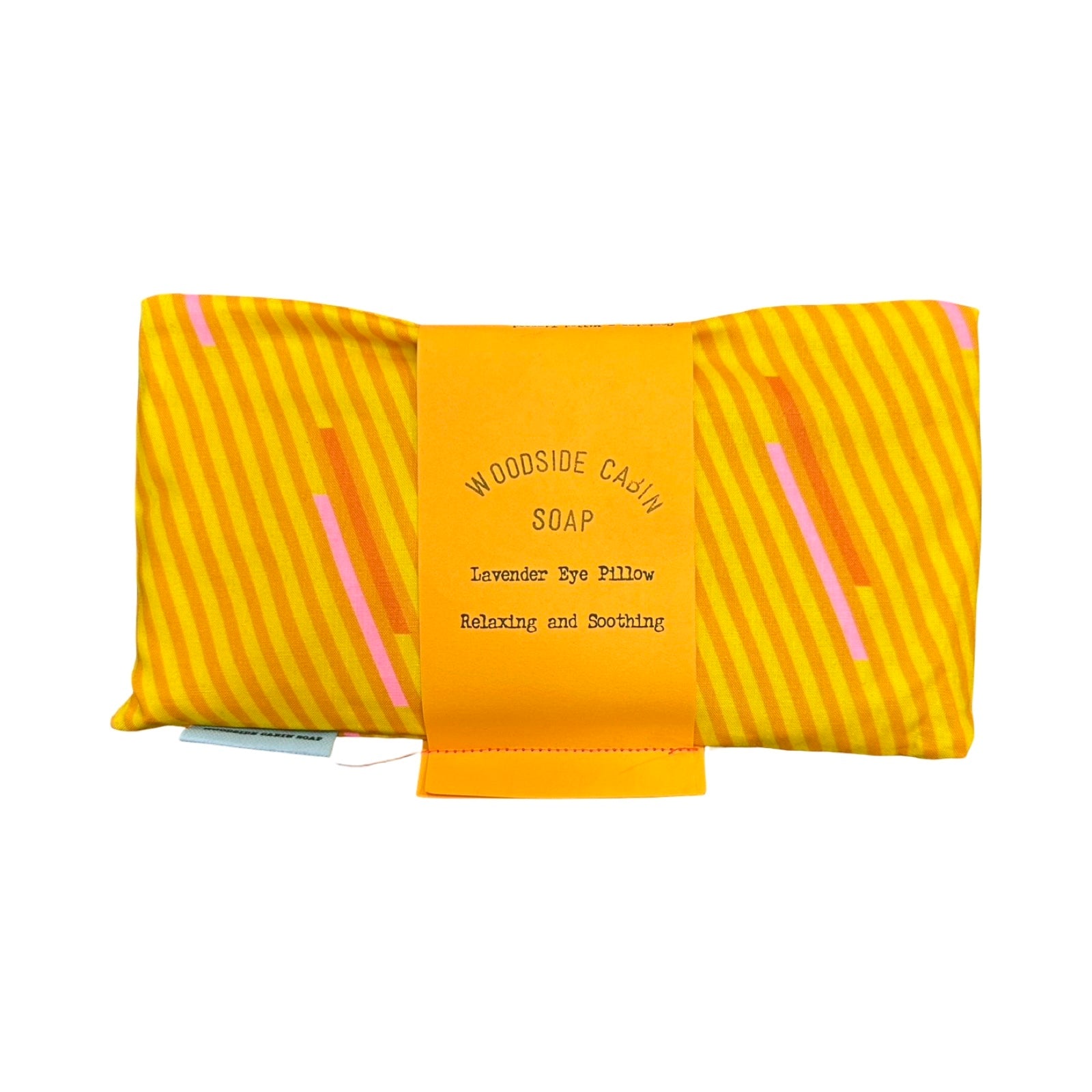 Woodside Cashmere Soap lavender eye pillow in yellow and orange striped fabric package with a central orange paper band.