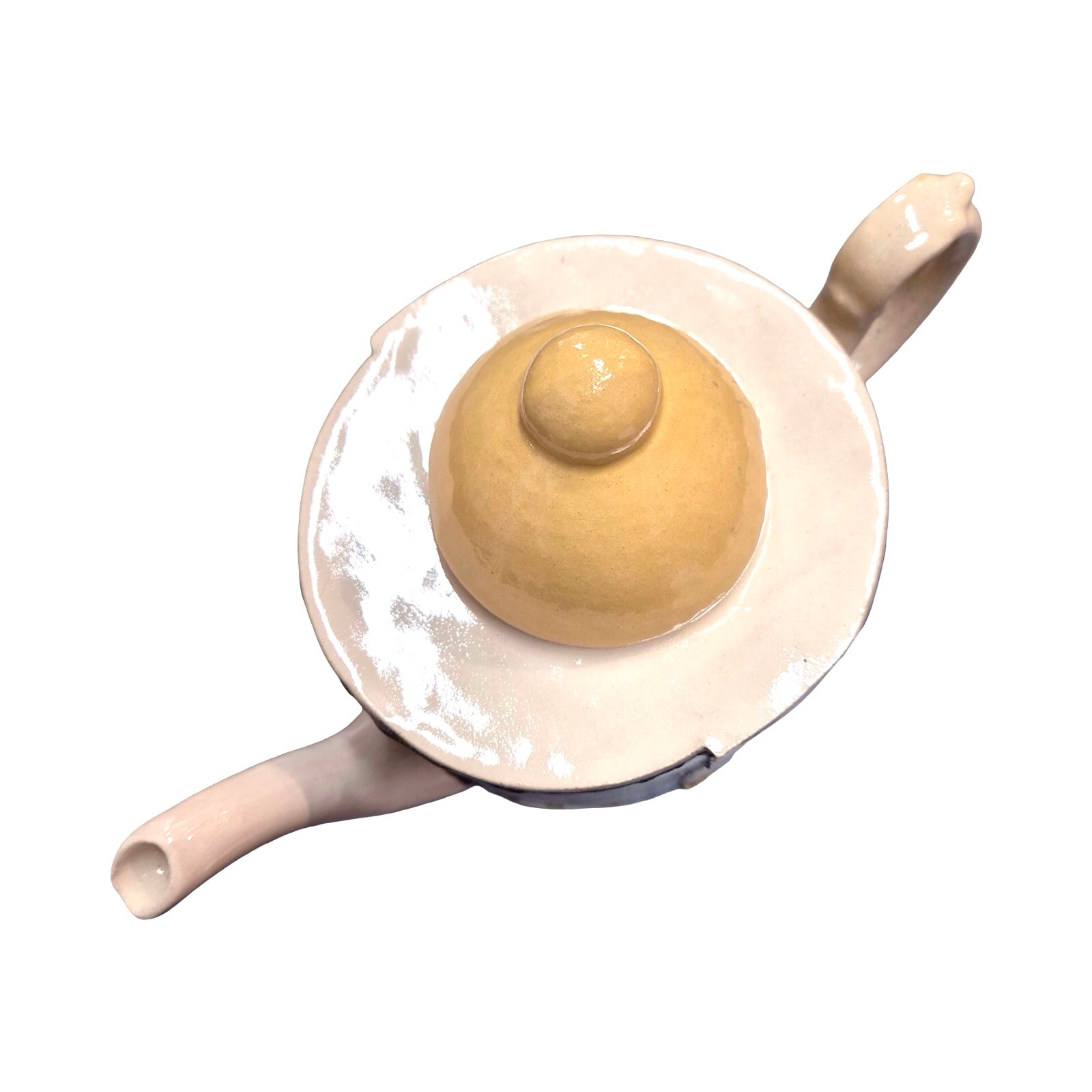 Ceramic teapot with a yellow lid on a white background.