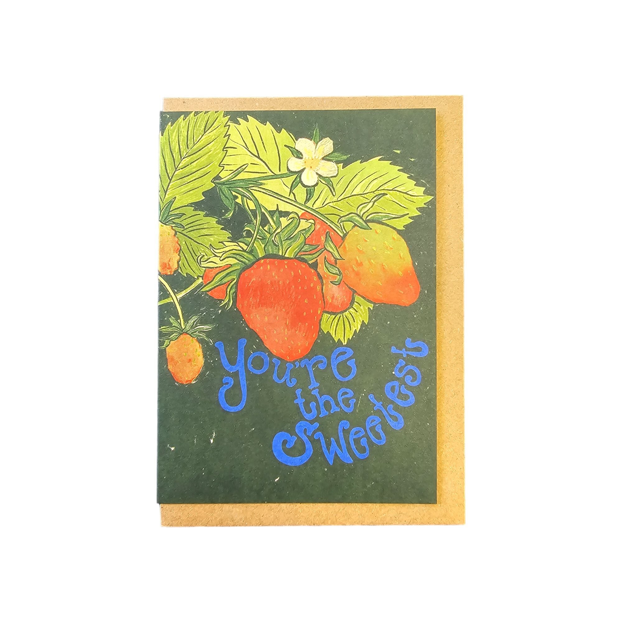 Card featuring a growing bunch of strawberries with the text 'you are the sweetest' in blue lettering, all against a forest green background