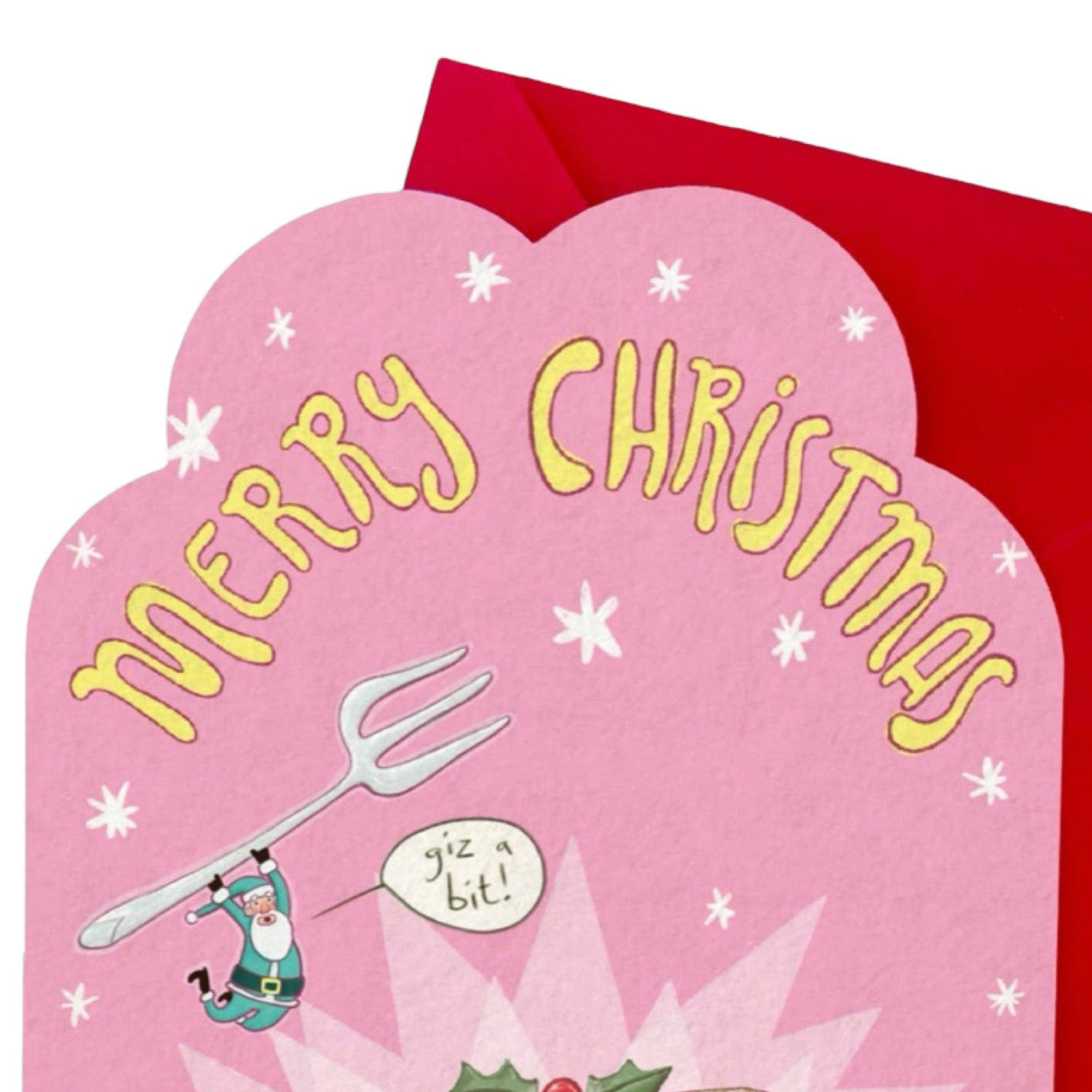 A pink Christmas greeting card with a scalloped edge, yellow 'MERRY CHRISTMAS' lettering, a cartoon Santa holding a fork, and a red envelope behind it on a white background.