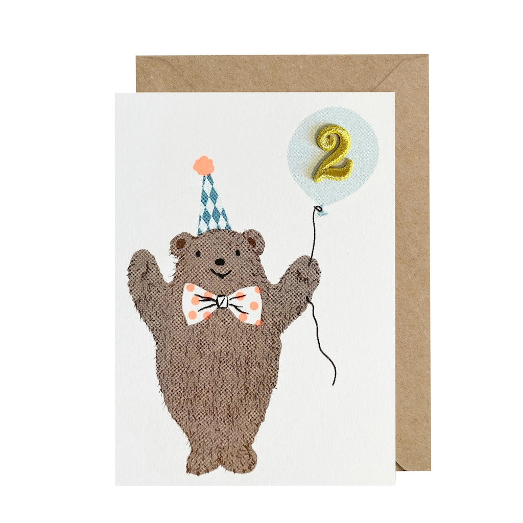 2nd birthday card featuring a bear in a party hat and '2' in a light blue balloon.