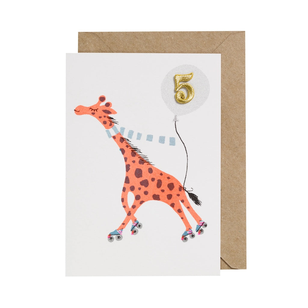 Greeting card with a giraffe and number 5 balloon on a white background.