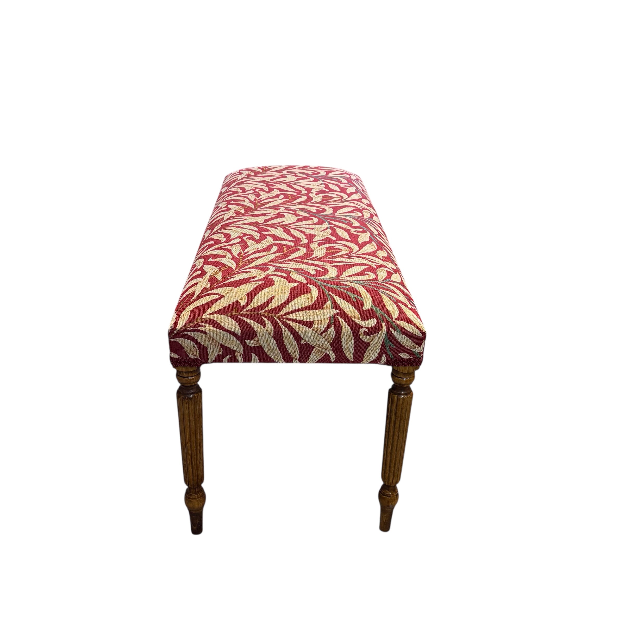 This hand-crafted rectangular bench is great for extra seating or to put your feet up on and relax. It is covered in beautiful William Morris Willow Bough tapestry-style fabric in dark red and cream. It is finished with navy blue binding and has mahogany-stained wooden legs.