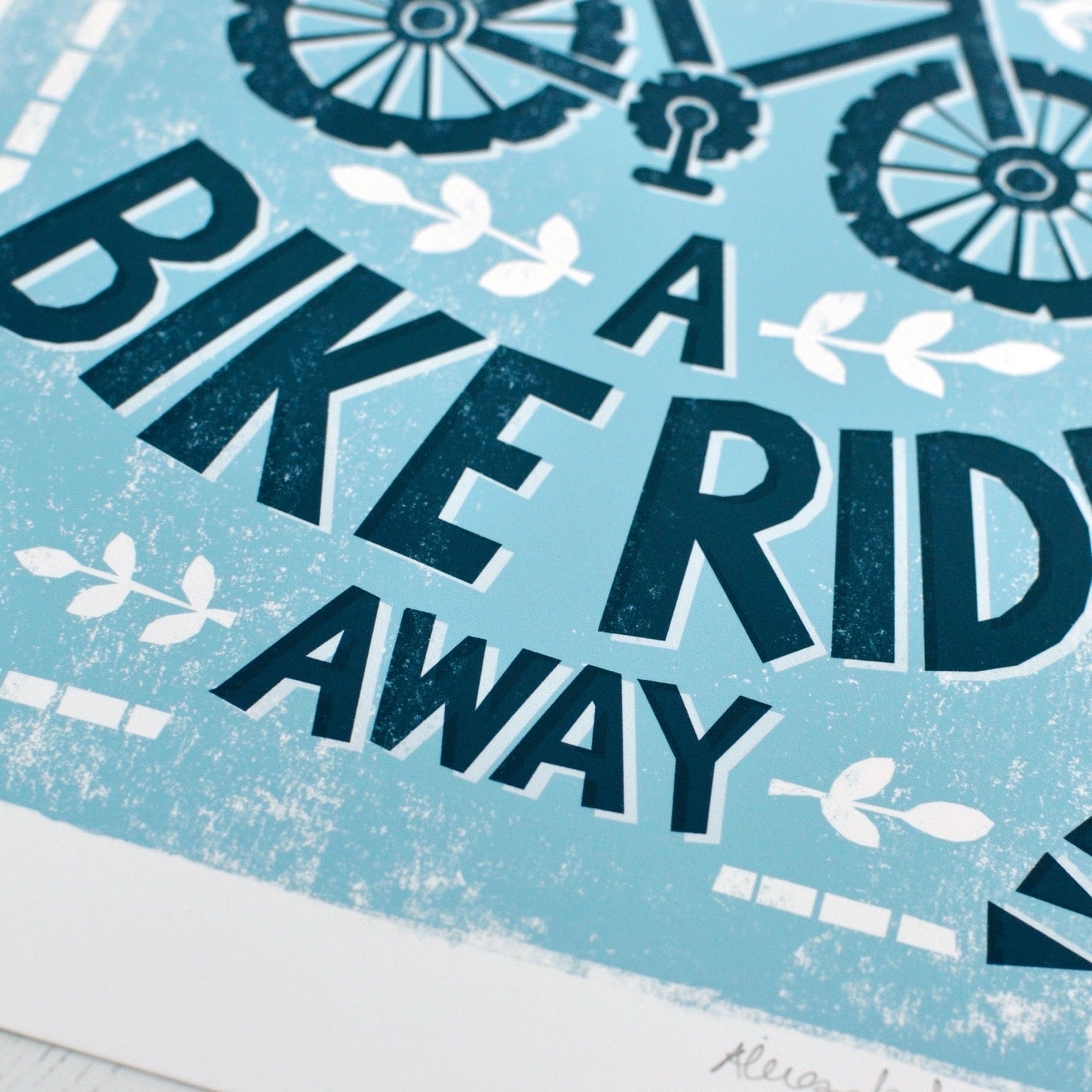 Text 'A Bike Ride Away' with bicycle graphics on a blue background.