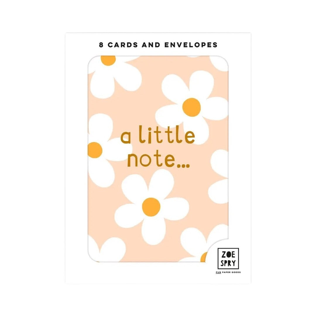 Pack of 8 mini cards featuring white daisies with orange centres against a peach background and the text 'a little note...' written in brown