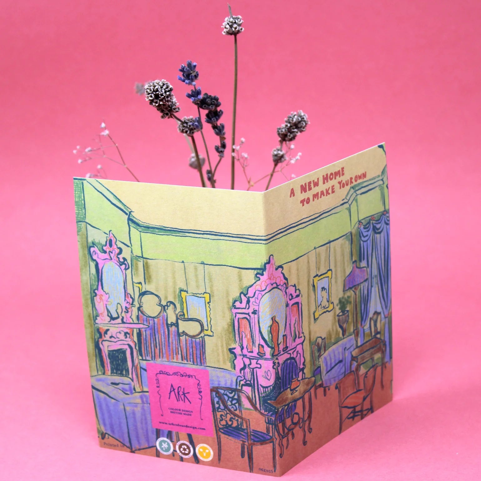 Card with a colourful interior design illustration on a pink background.