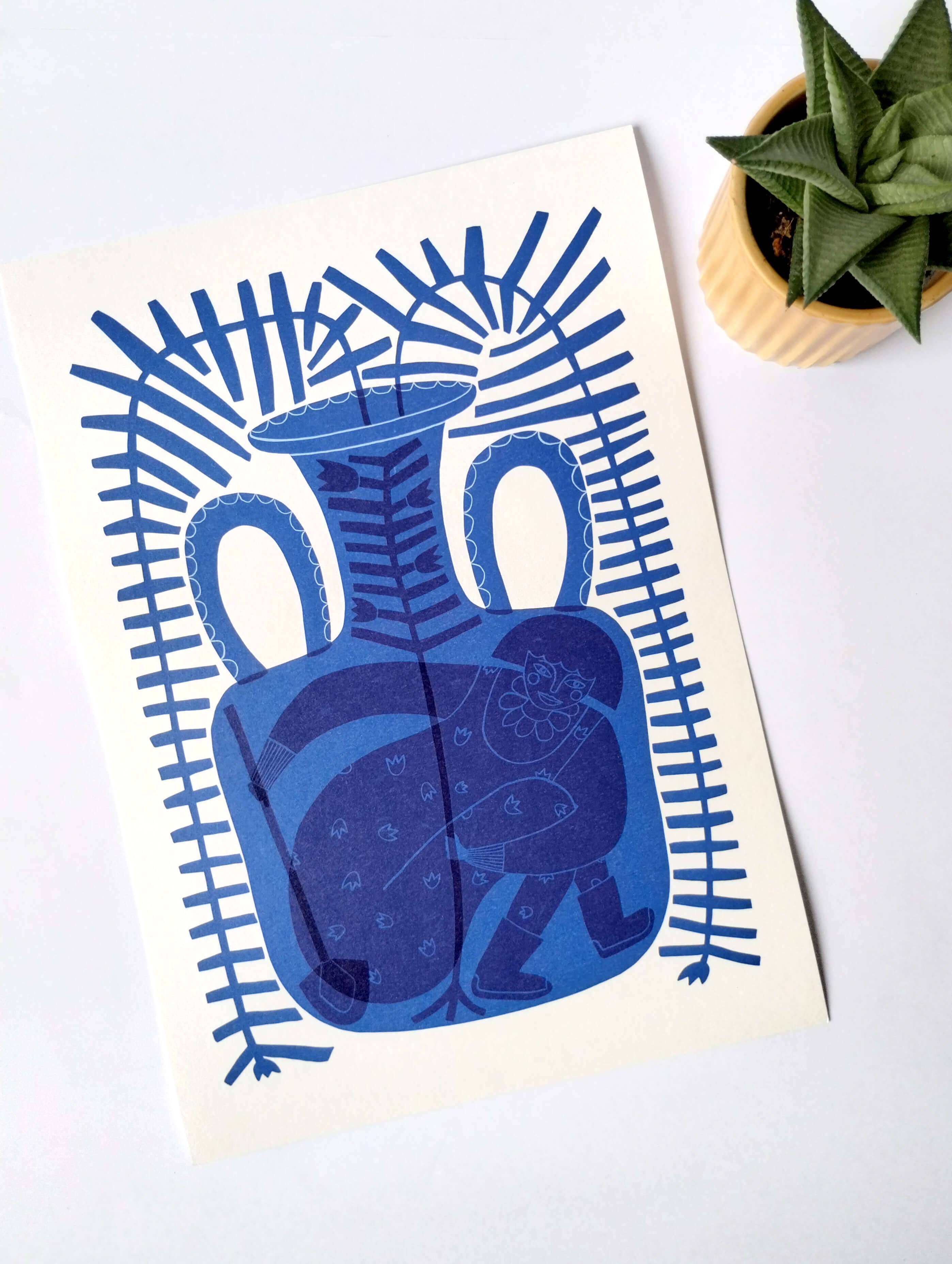 Blue vase illustration on a white card with a plant in the background.