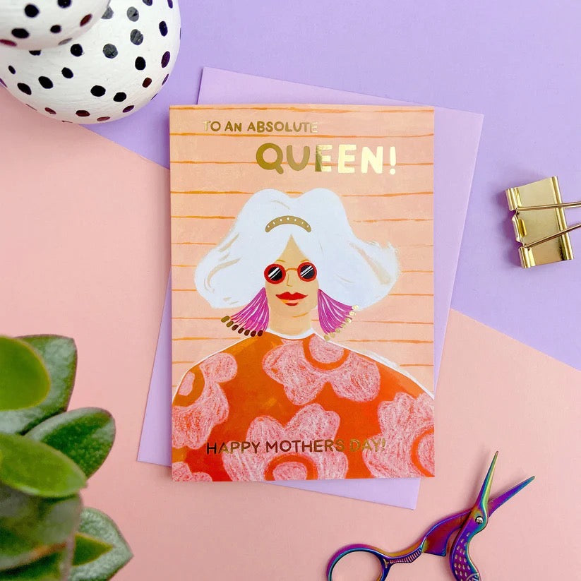 Greeting card with illustration of a woman and text 'An Absolute Queen! Happy Mother's Day!' on a colourful background.