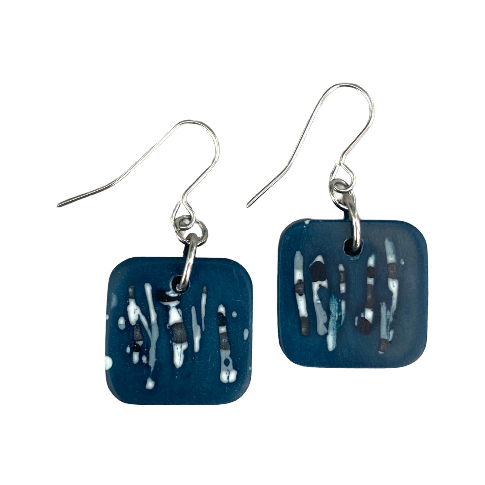 Blue square drop earrings with a black and white abstract design and silver earring hooks.