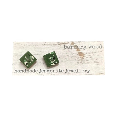 Green square stud earrings with a black and white abstract design.