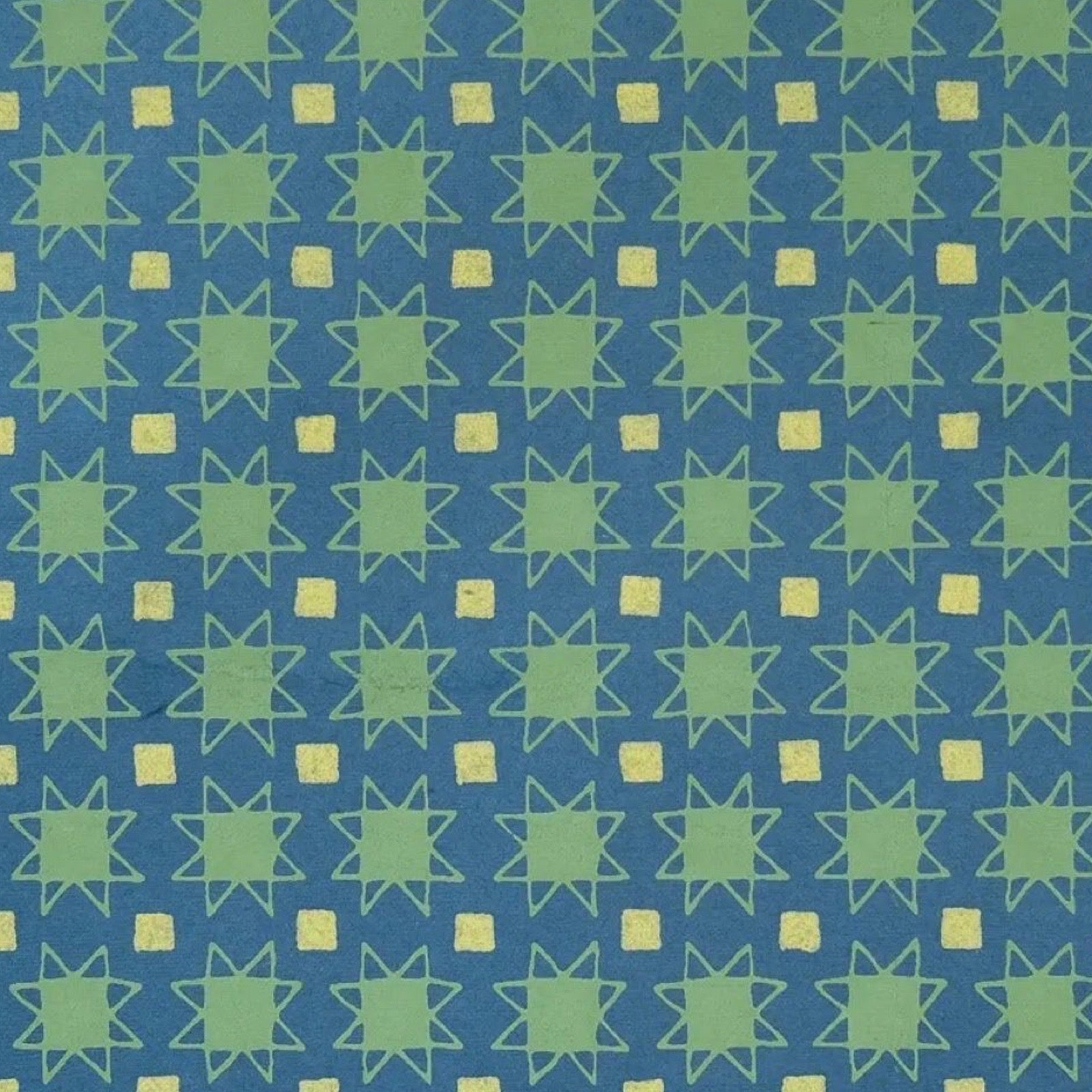 Pattern of green stars and squares on a blue background.