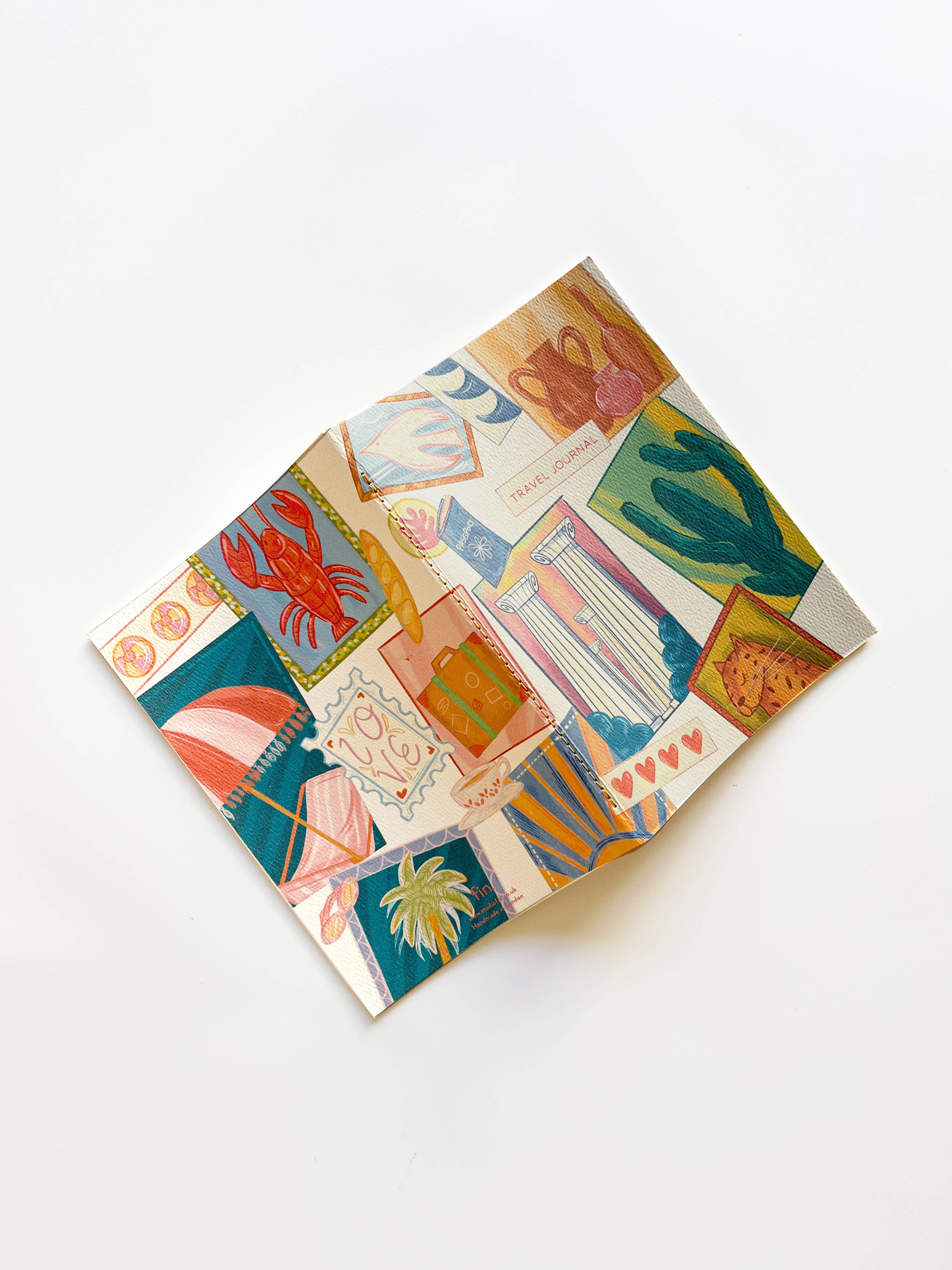 Colorful patterned notebook on a white background.