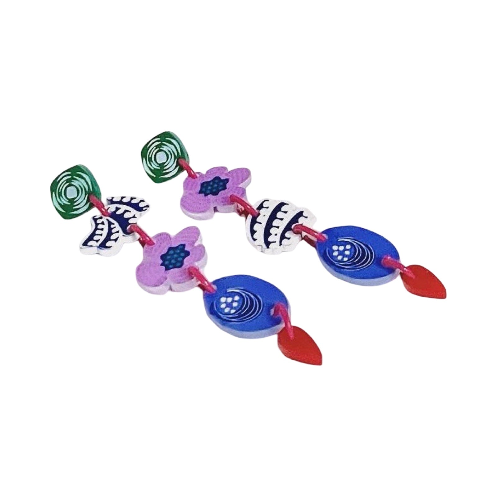 A pair of acrylic dangle earrings with green squares, pink flowers, navy and white leaves and blue leaves.