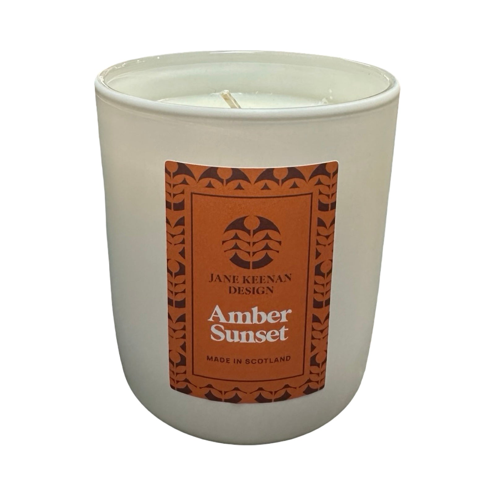 Candle with a Jane Keenan Design label on a white background.