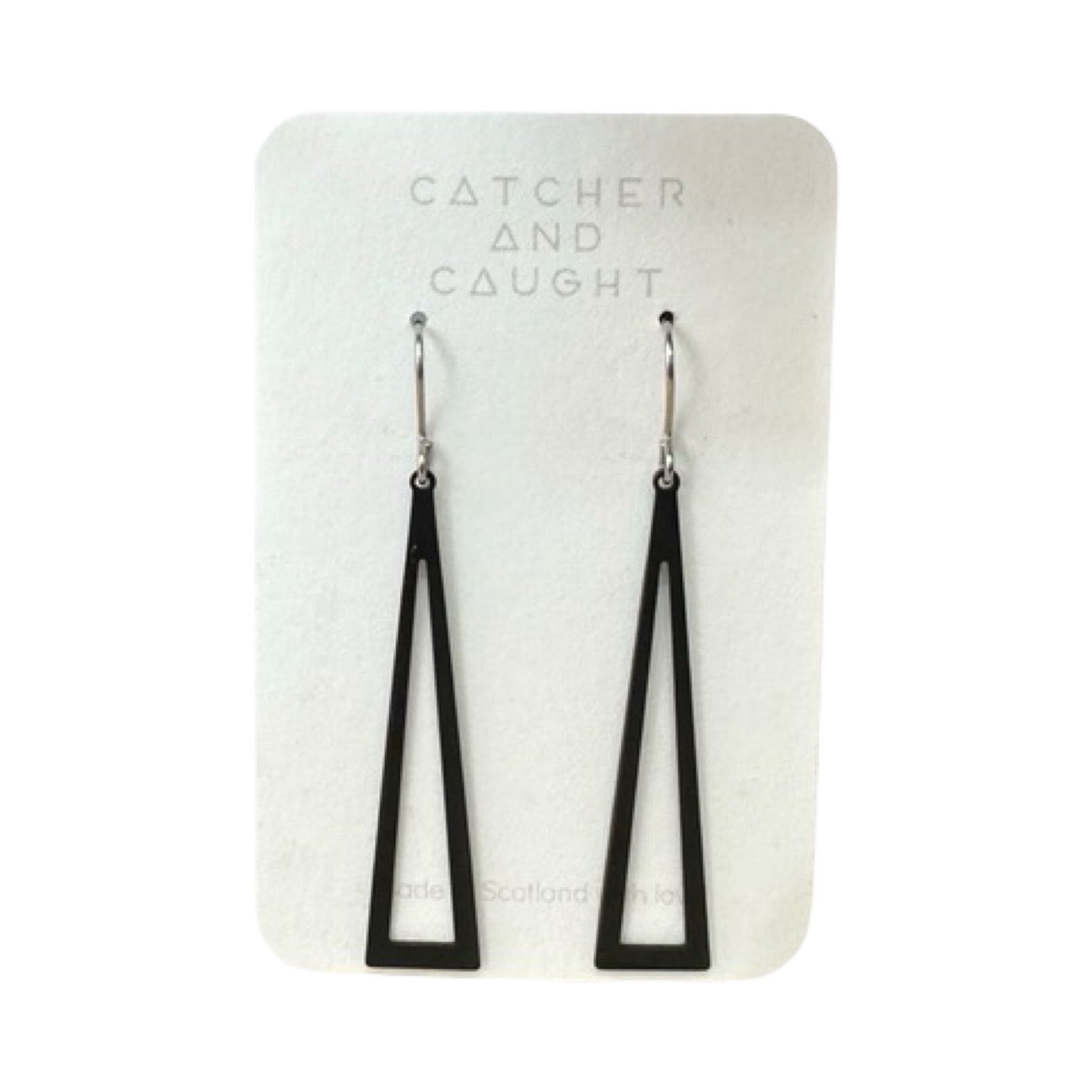 Photo of a pair of black, triangle-shaped swing earrings. Anita Earrings. Made from plated brass with sterling silver ear clasps.