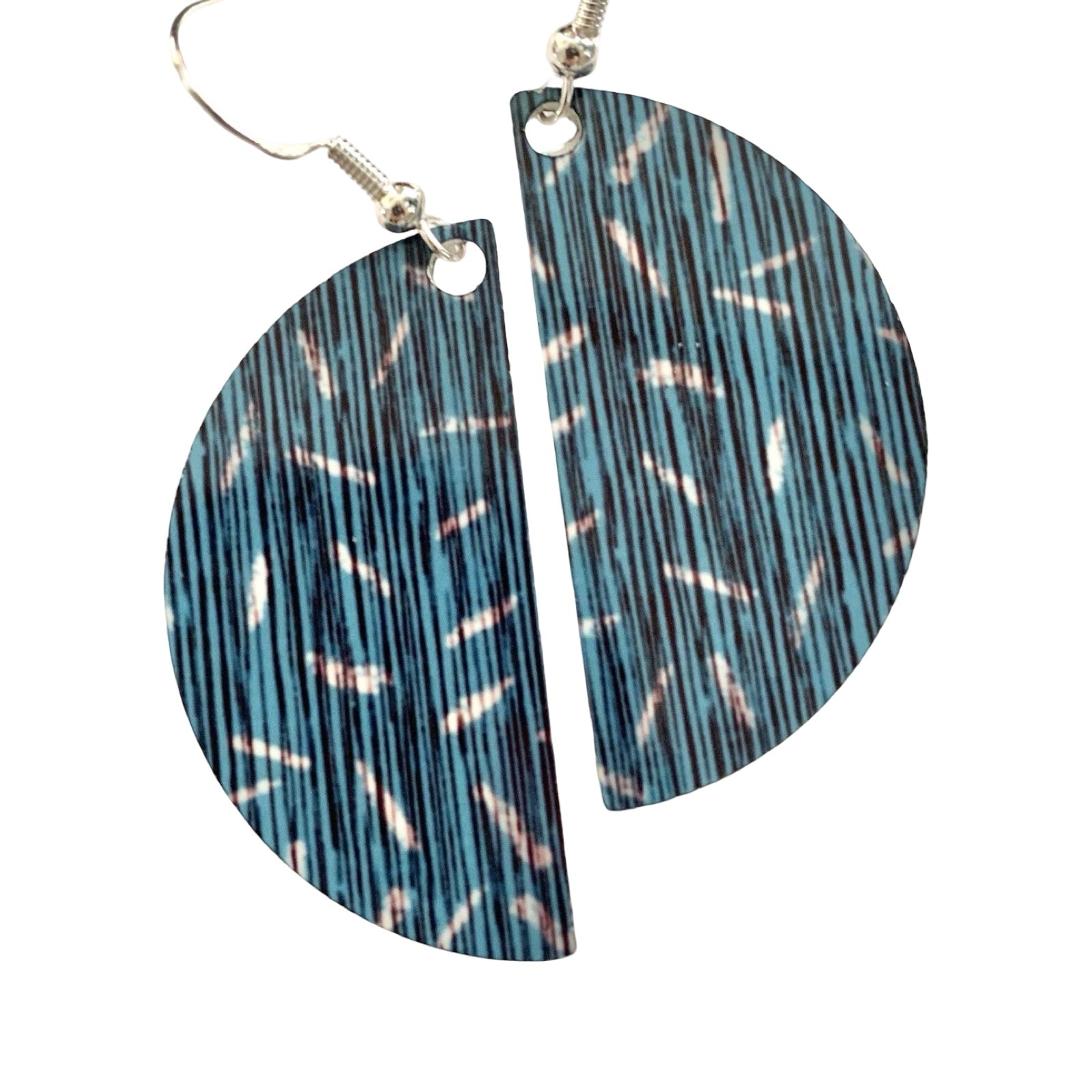 Pair of earrings with blue and black pattern on a white background.