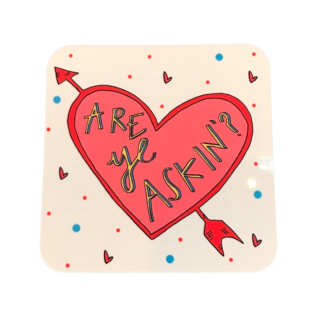 Drinks coaster featuring a red heart with an arrow through it on a white background with small love hearts and the text 'Are ye Askin?'