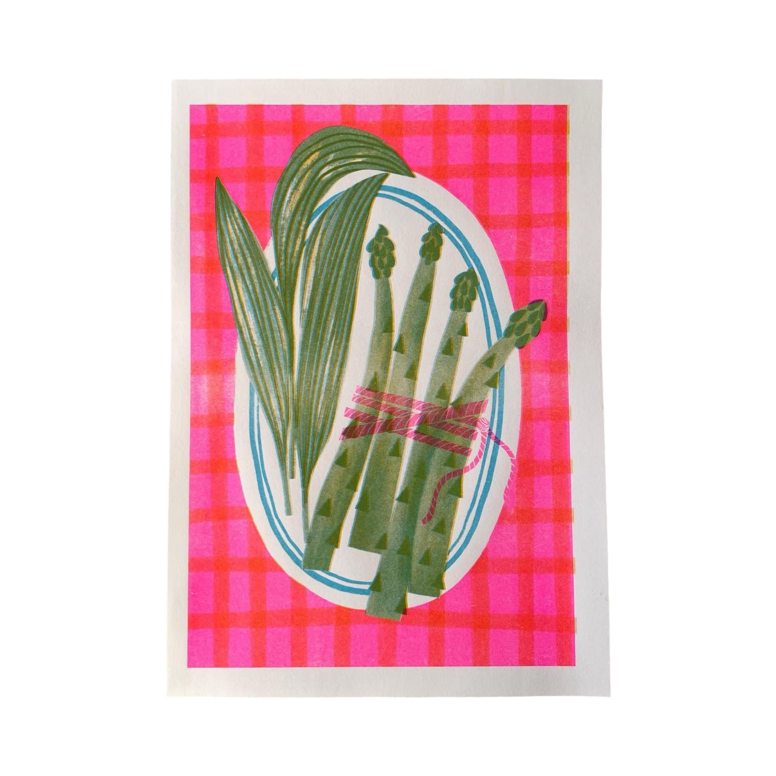 Illustration of green asparagus on a pink plaid background.