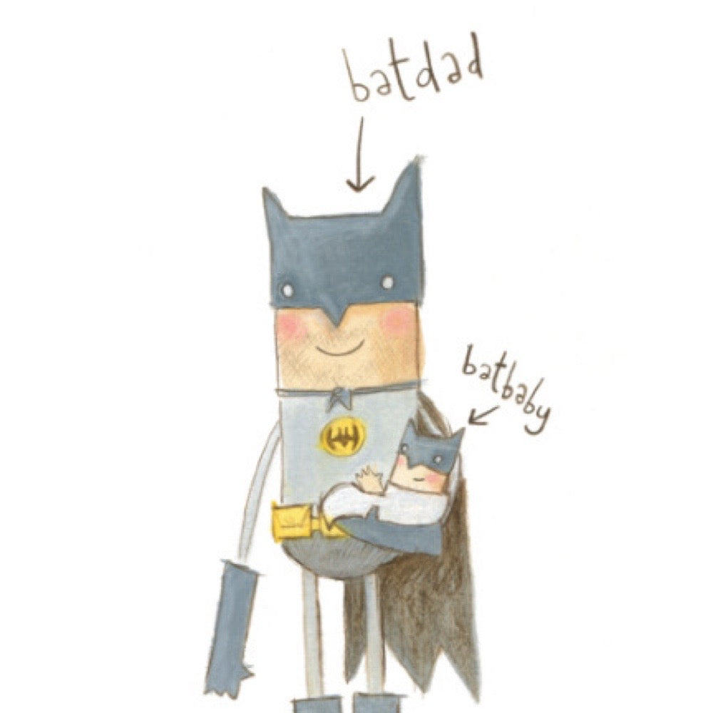 Batman holding a Batbaby, both labelled by arrows.