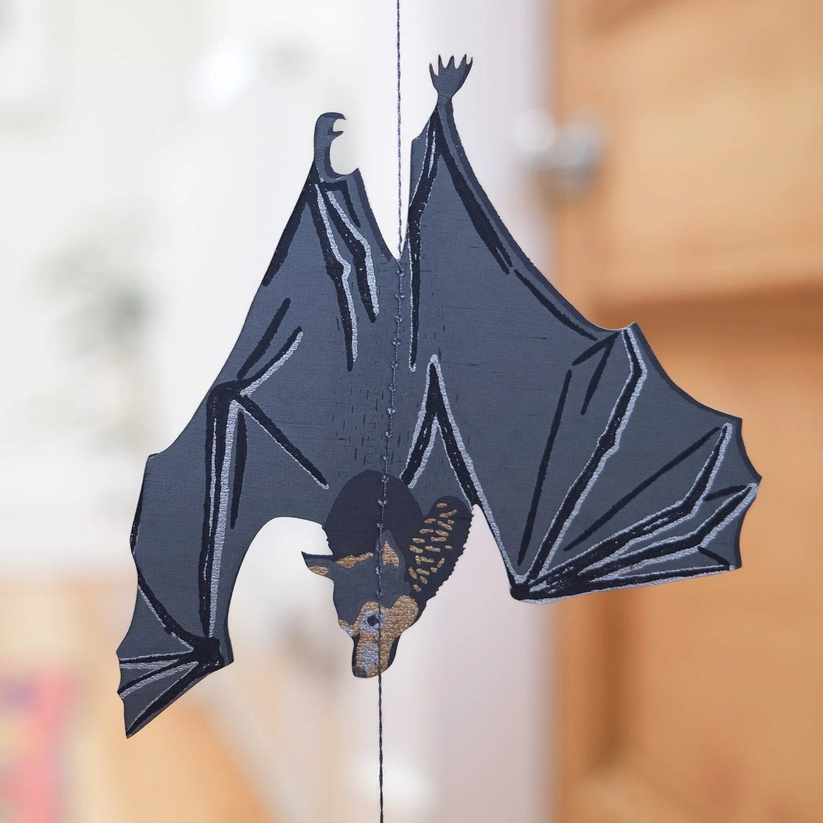 Close up of a bat vertical hanging.
