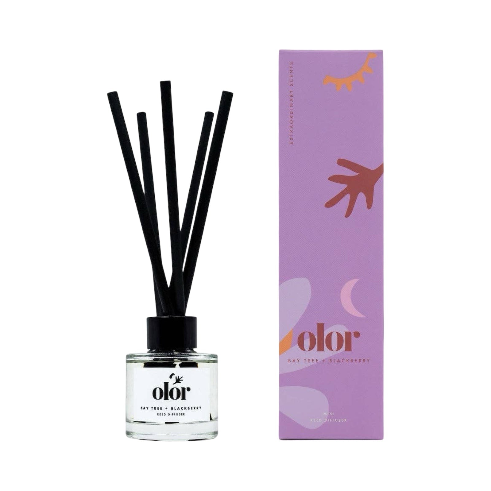 Reed diffuser next to a purple box.