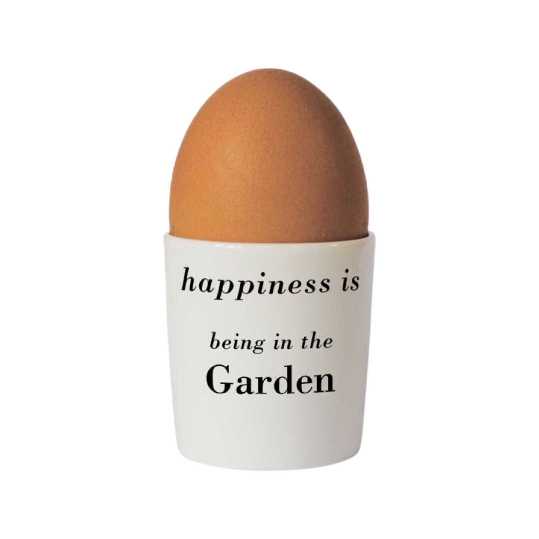 Bee lovers bone china egg cup with the text 'happiness is being in the garden' written in black on the back.