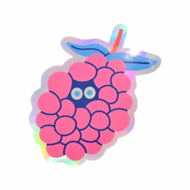 This holographic vinyl sticker is shaped like a bunch of pink berries with a pair of eyes in the centre.