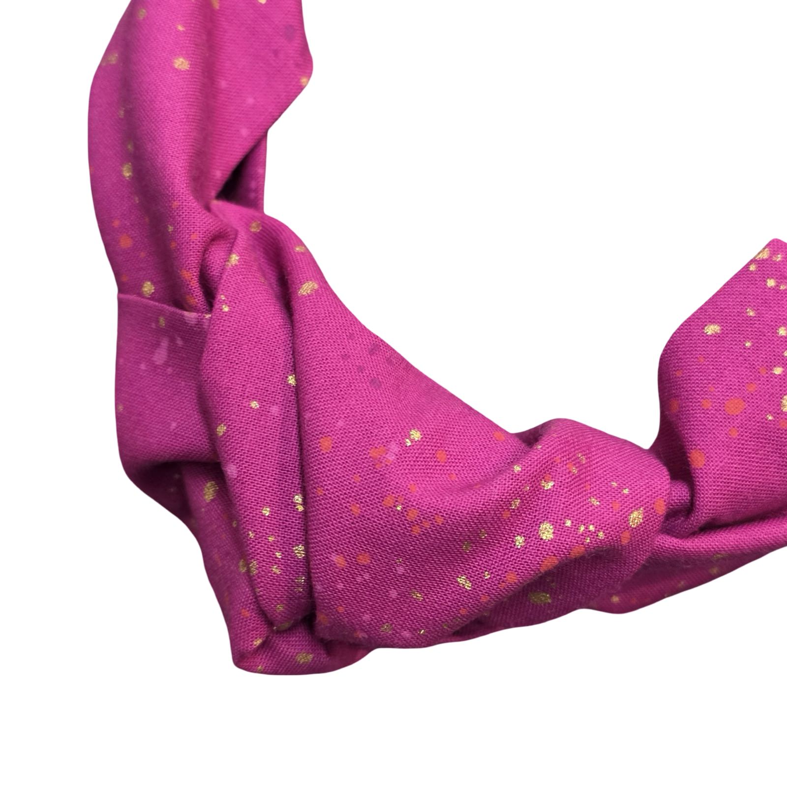 This berry pink handmade speckled top knot Alice band is made from 100% cotton fabrics with metallic speckles.
