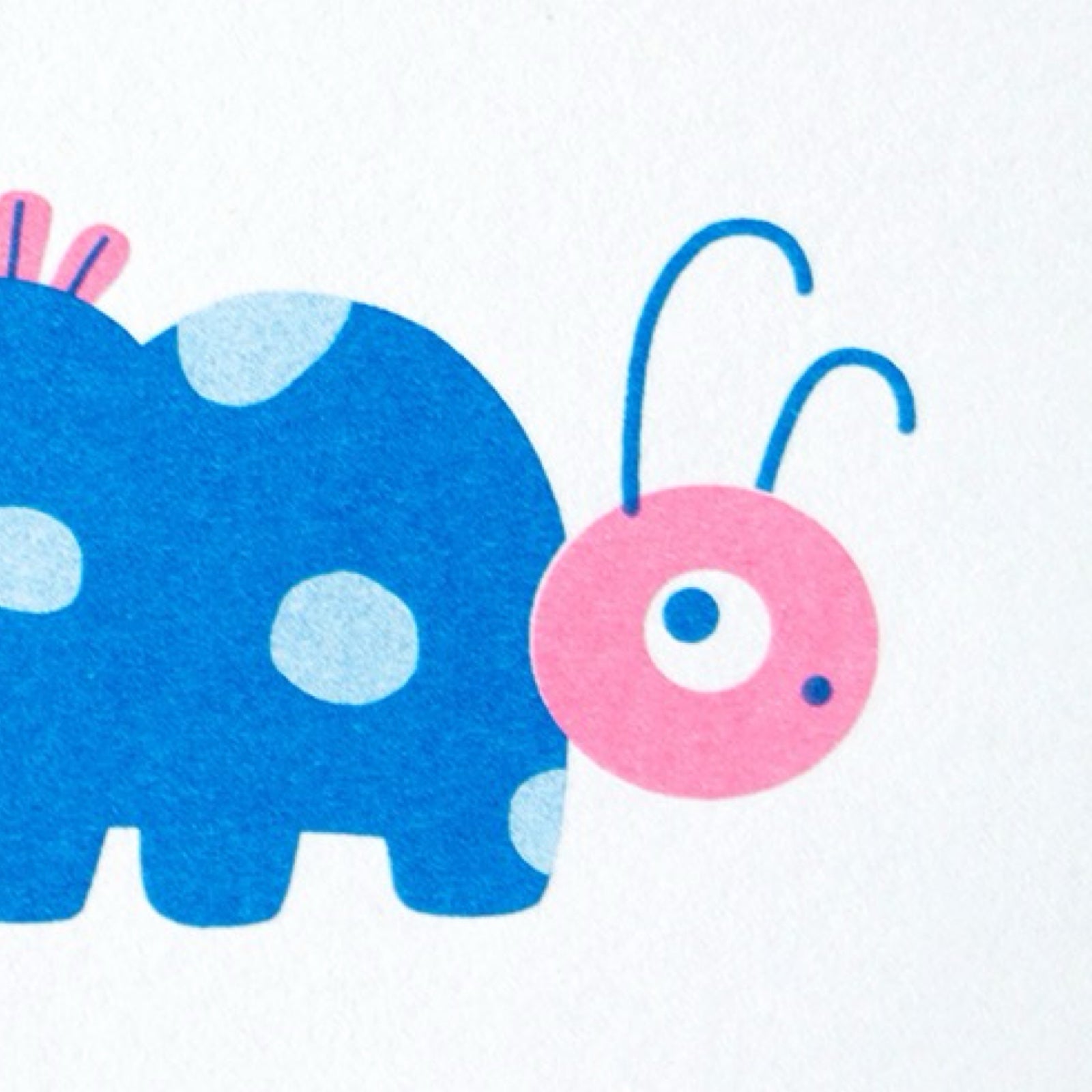 A rectangular risograph mini print of a blue caterpillar with pale green spots and a pink head