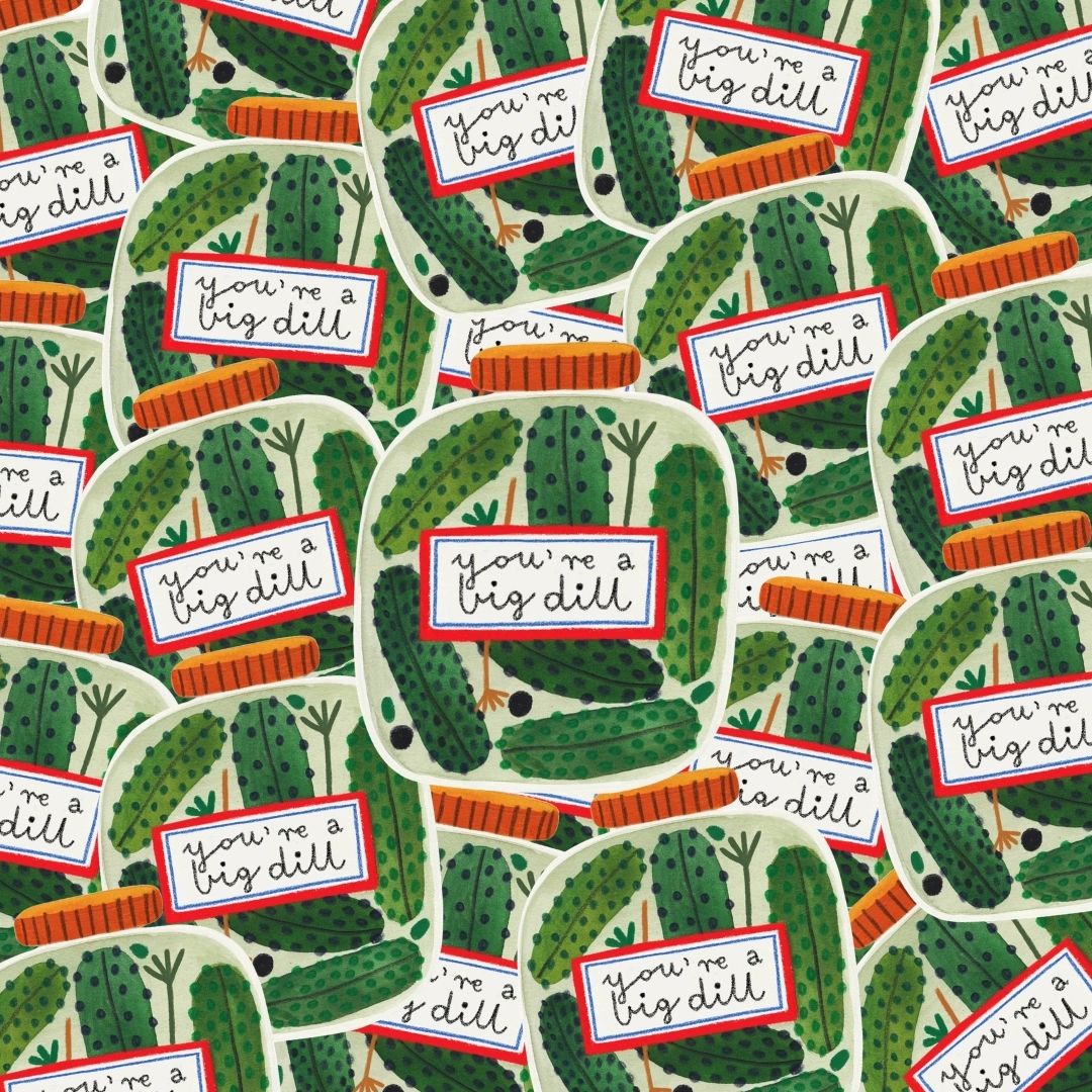 A pile of stickers of jars with dills with white labels that read 'you're a big dill' in black script, outlined in red, on a light background.