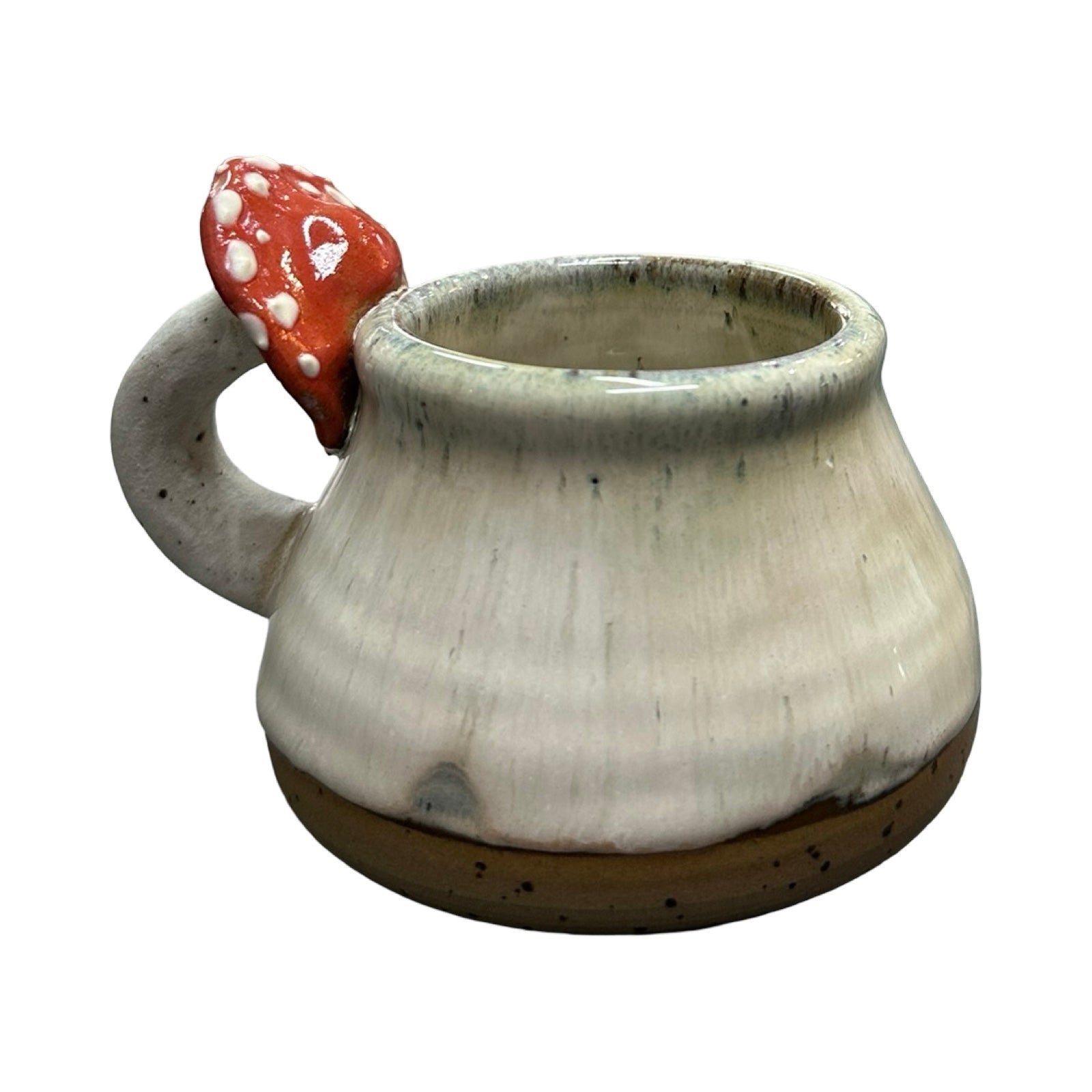 Ceramic mug with a red mushroom-shaped handle on a white background.