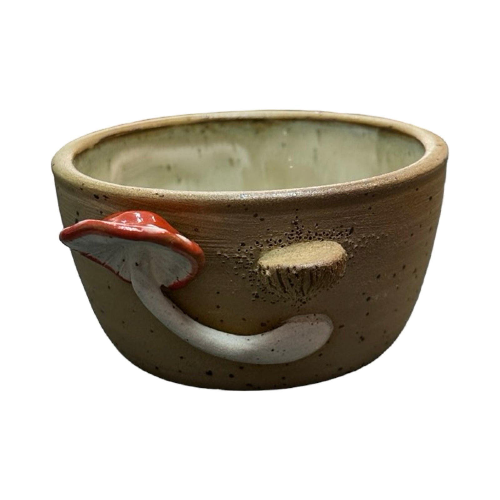 Ceramic trinket dish with mushroom design on a white background.