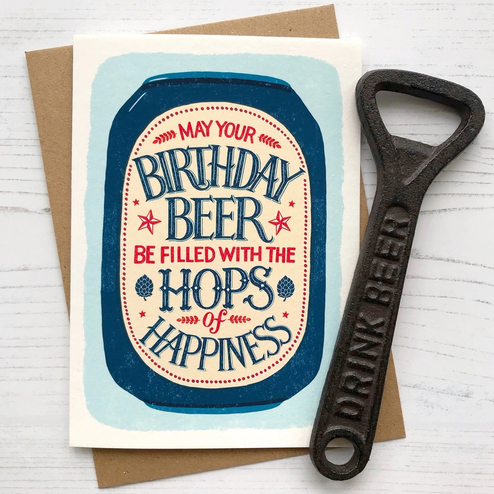 Birthday card with beer-themed design and bottle opener on a white background.