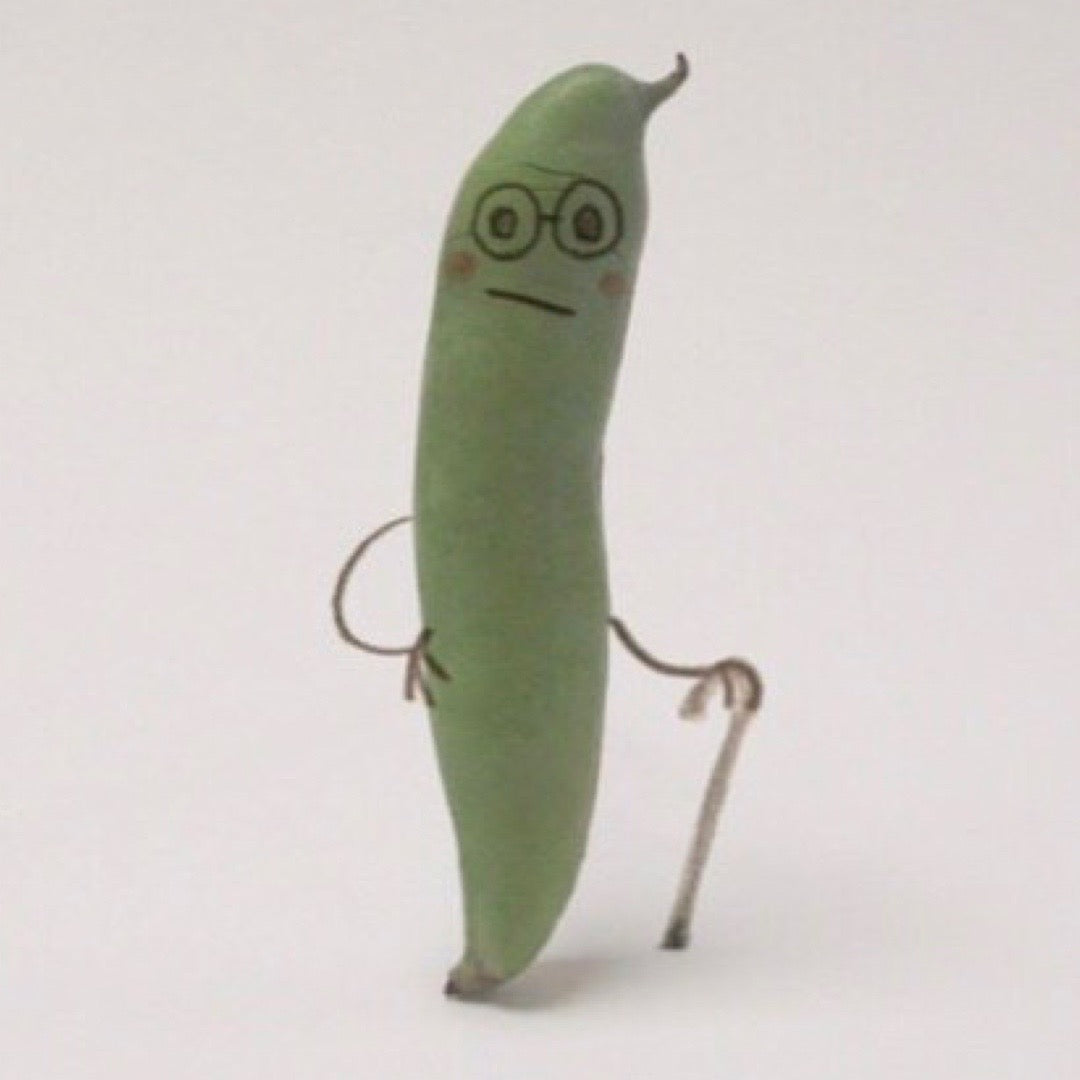 Green bean with a face and arms on a white background.