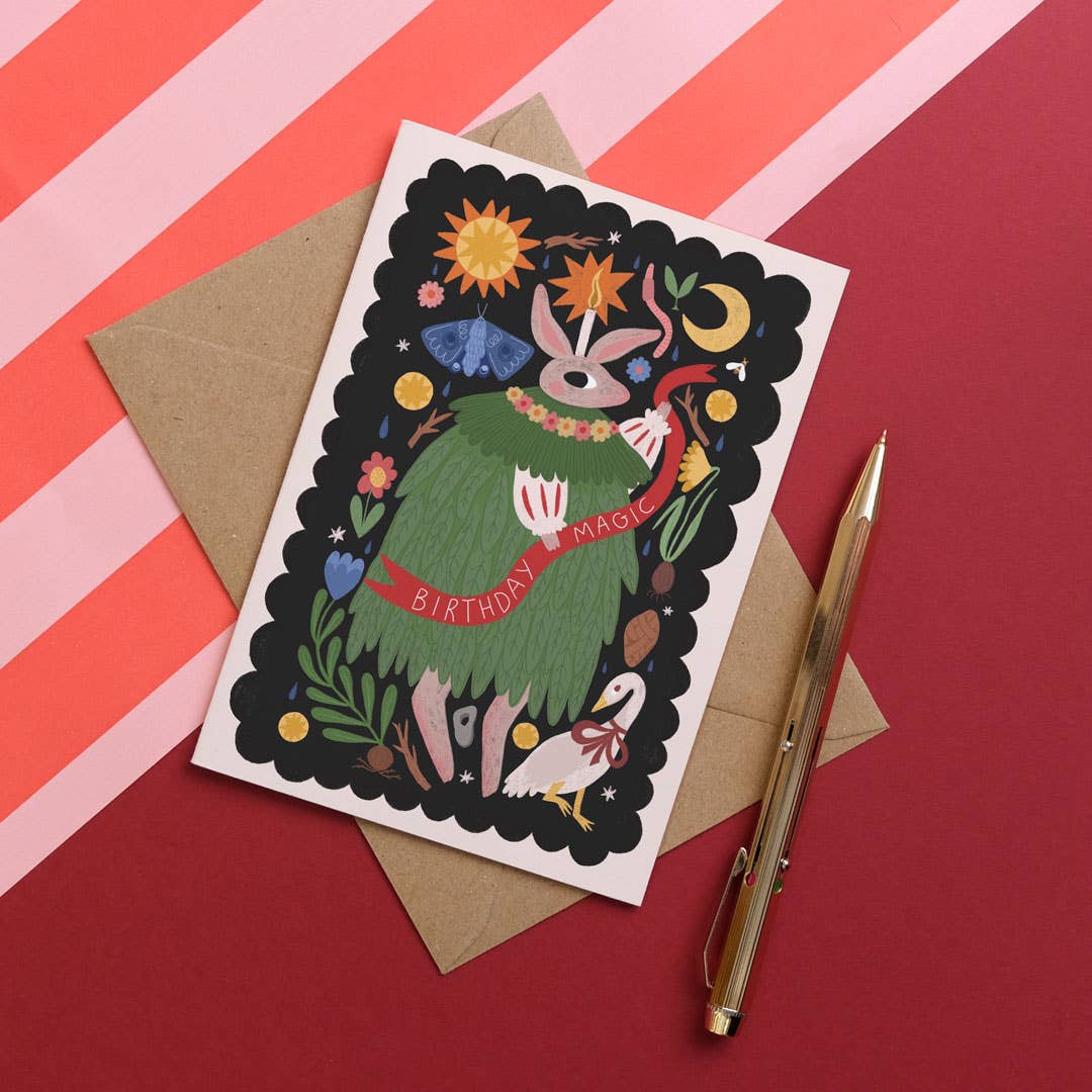 Greeting card with a colourful design on a red and pink striped background.