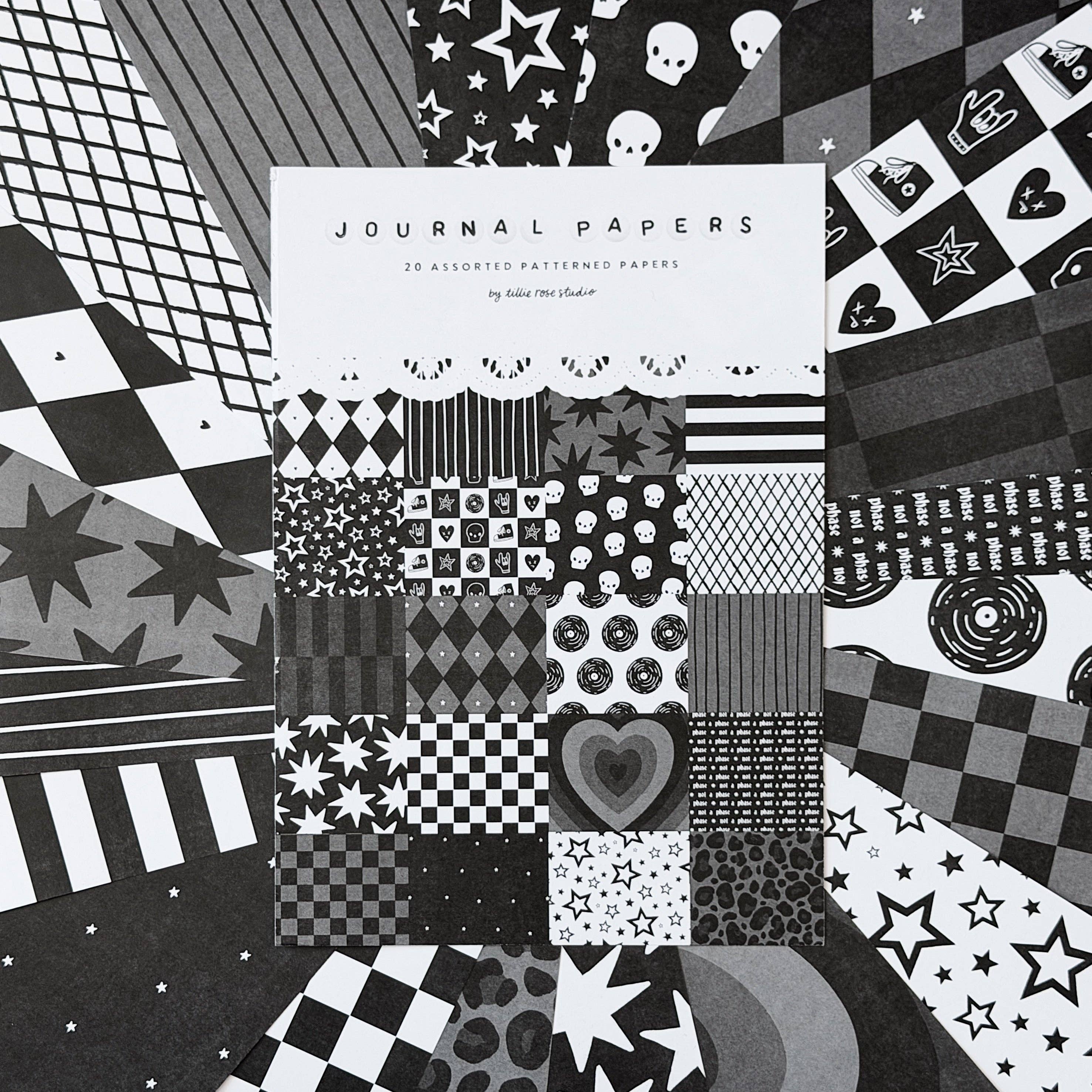 Pack of patterned papers with a variety of black and white designs on a checkered background.