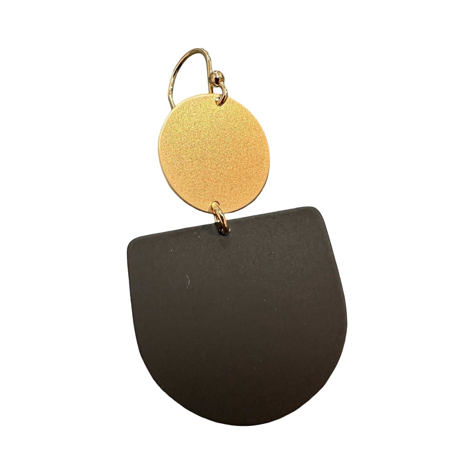 Gold and black earring on a white background.