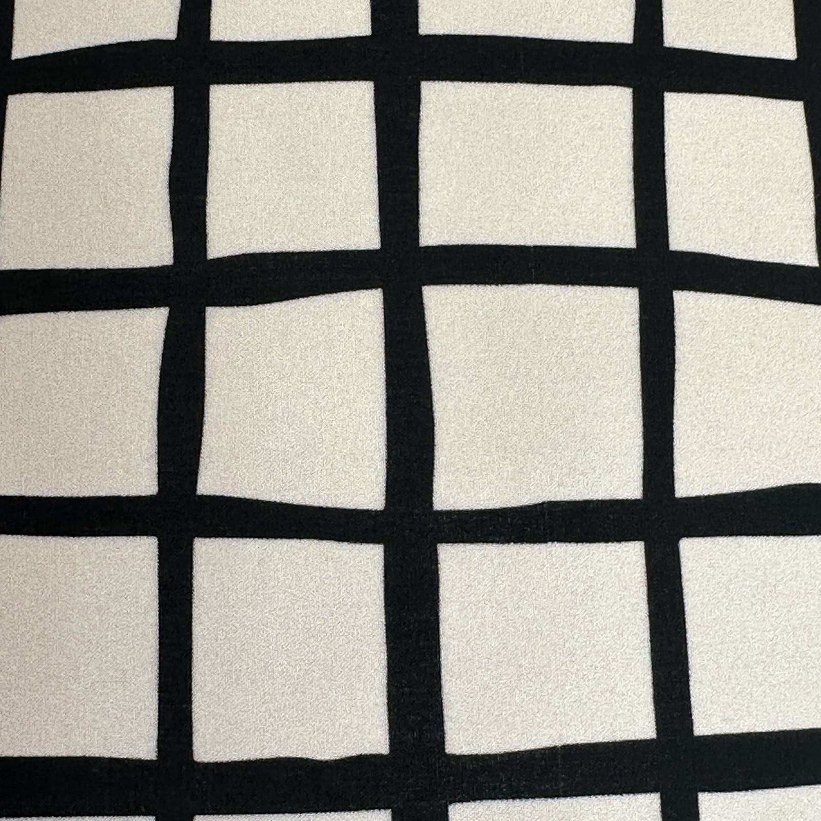 Black grid pattern fabric on a white background.