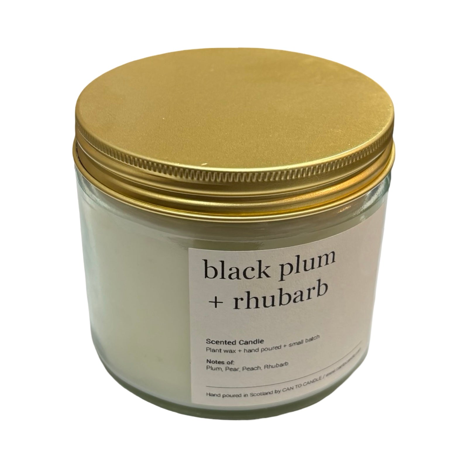 Candle jar with gold lid labeled 'black plum + rhubarb' on a white background.