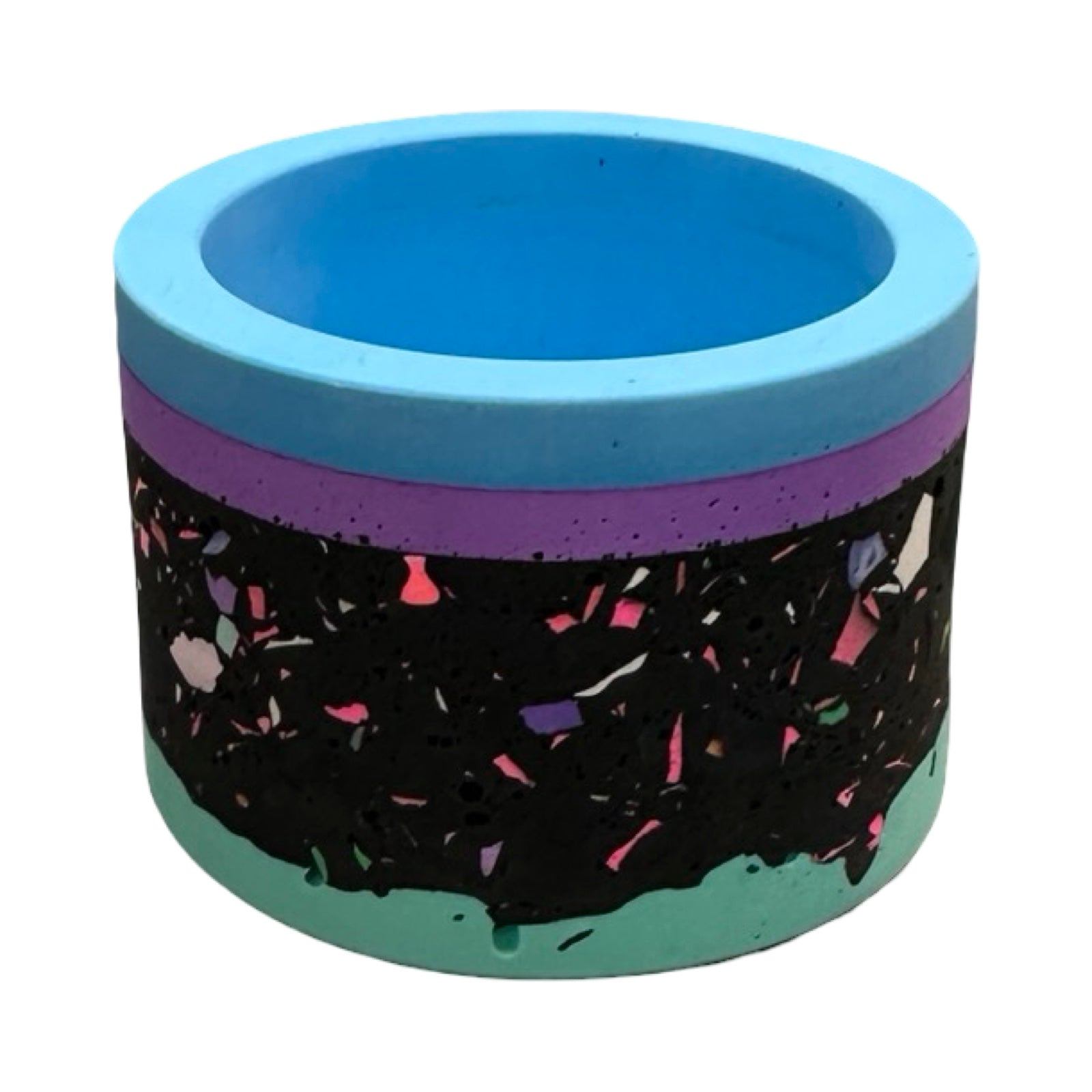 Cylindrical pot with blue top and bottom and black body with colorful pattern on a white background.