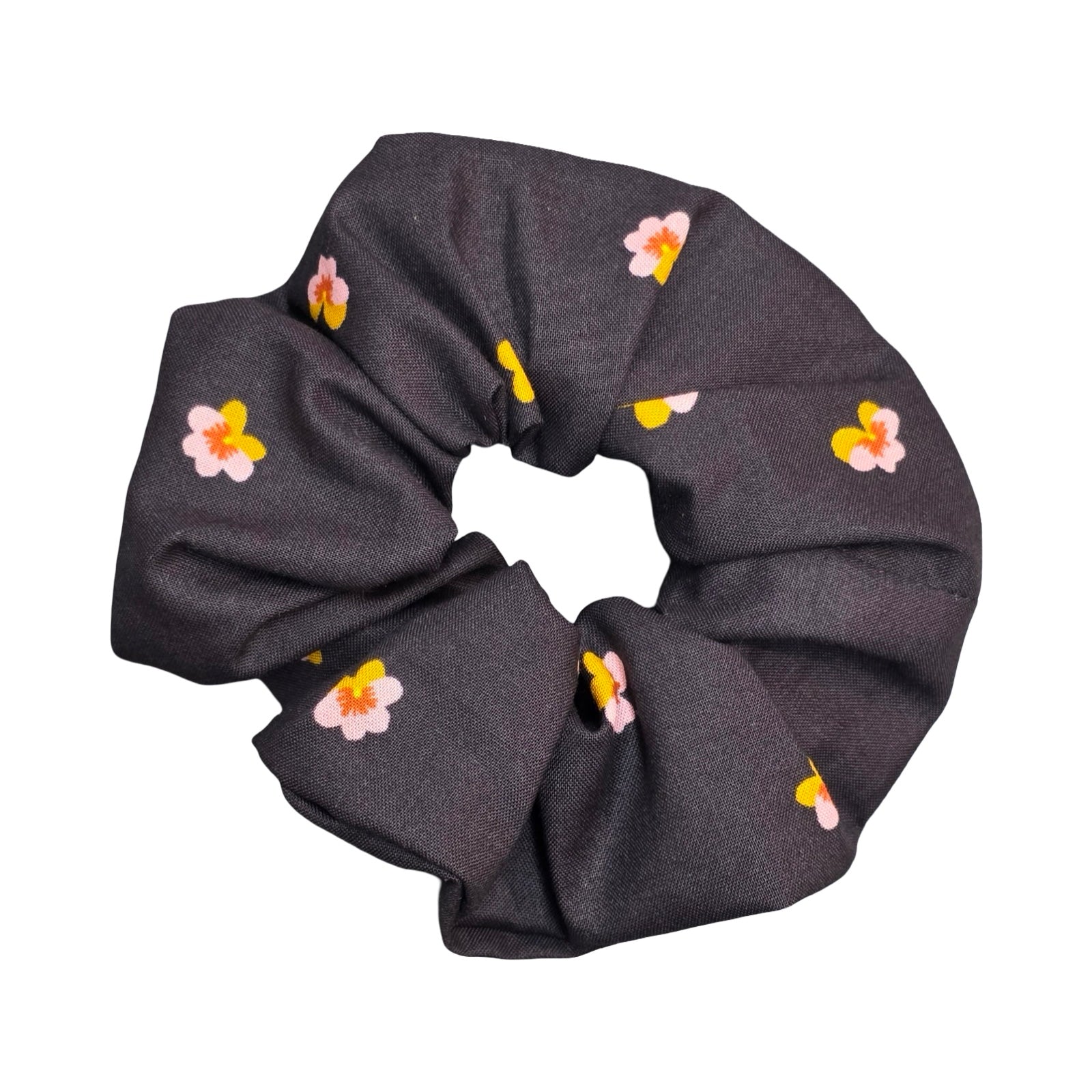 This black handmade hair scrunchie is made from 100% cotton fabric with pink and yellow violets.