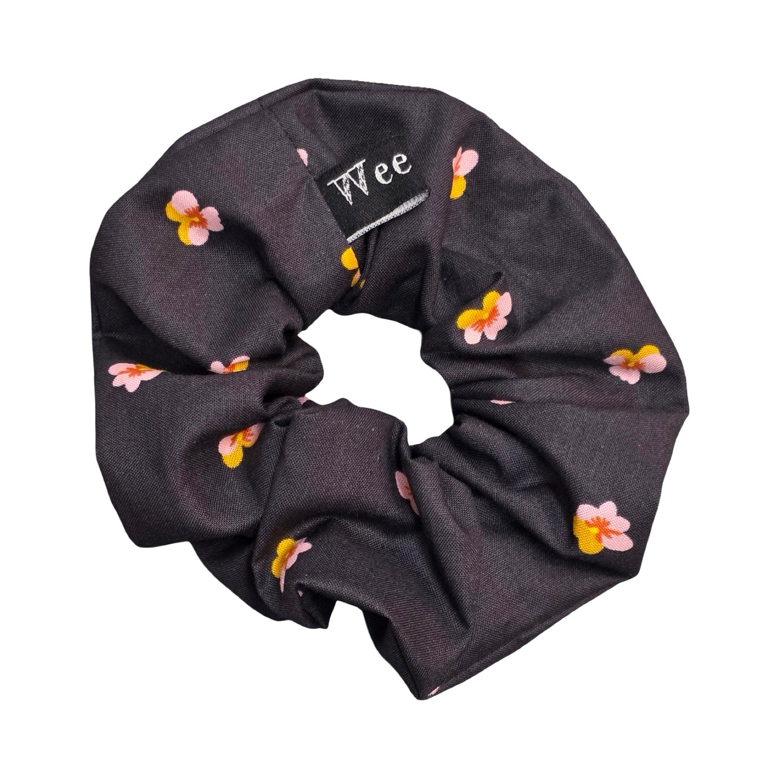 This black handmade hair scrunchie is made from 100% cotton fabric with pink and yellow violets.