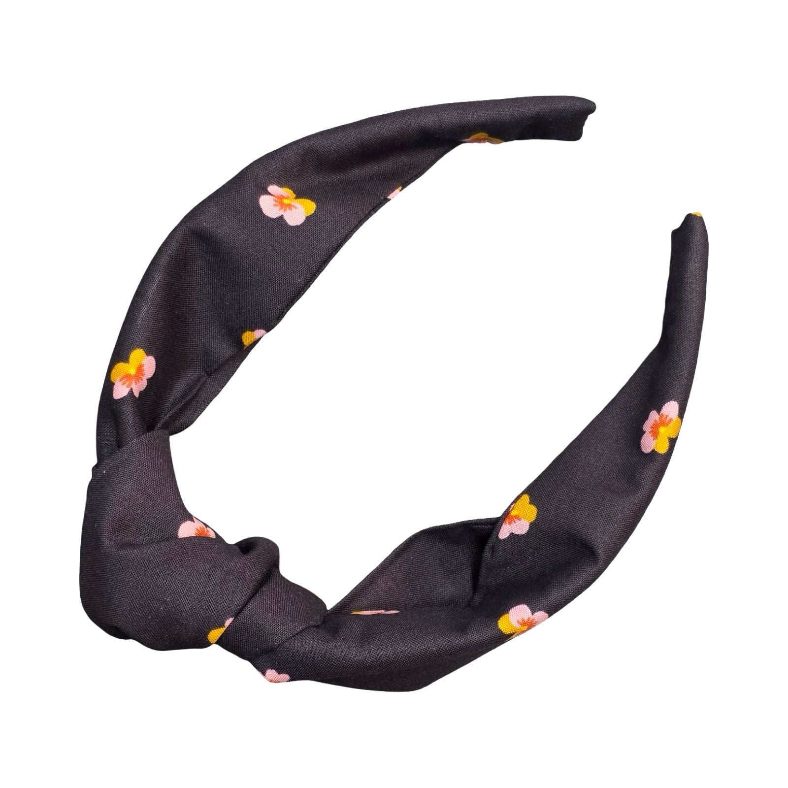 This black handmade floral top-knot Alice band is made from 100% cotton fabric with small mustard and pink violets. 