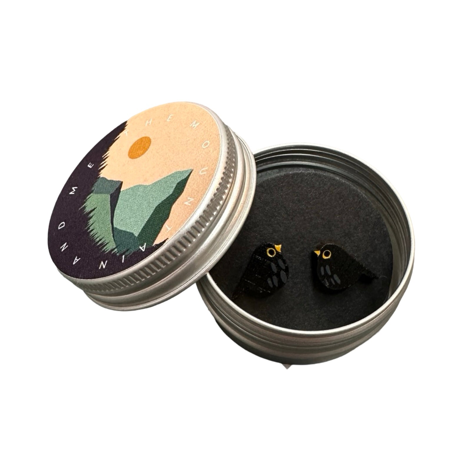 A pair of bird-shaped bamboo earrings hand painted as blackbirds in a small metal tin