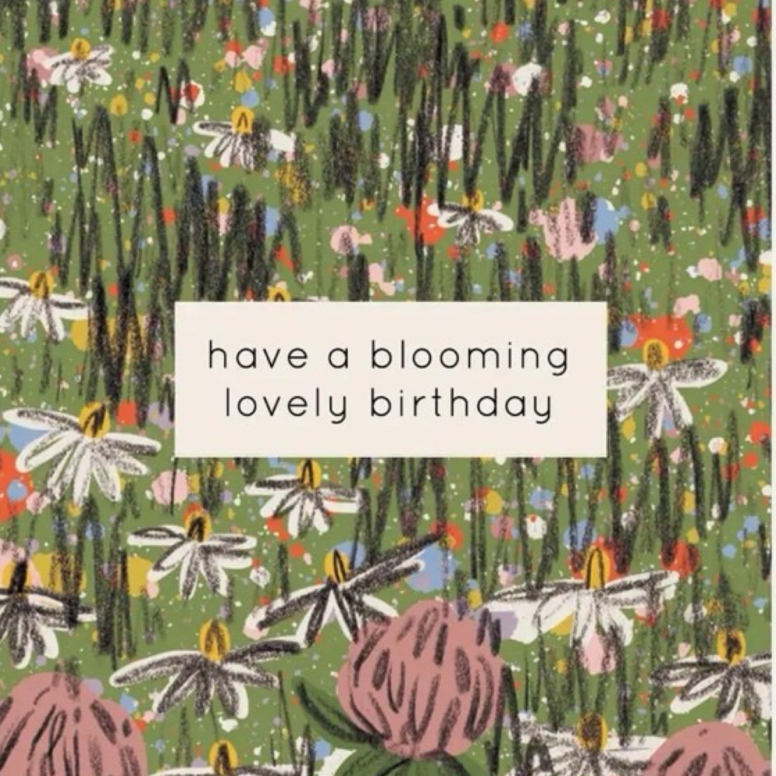 Birthday card featuring a hand-drawn spring meadow with colourful wildflowers and the text 'have a blooming lovely birthday' in a white box in the centre