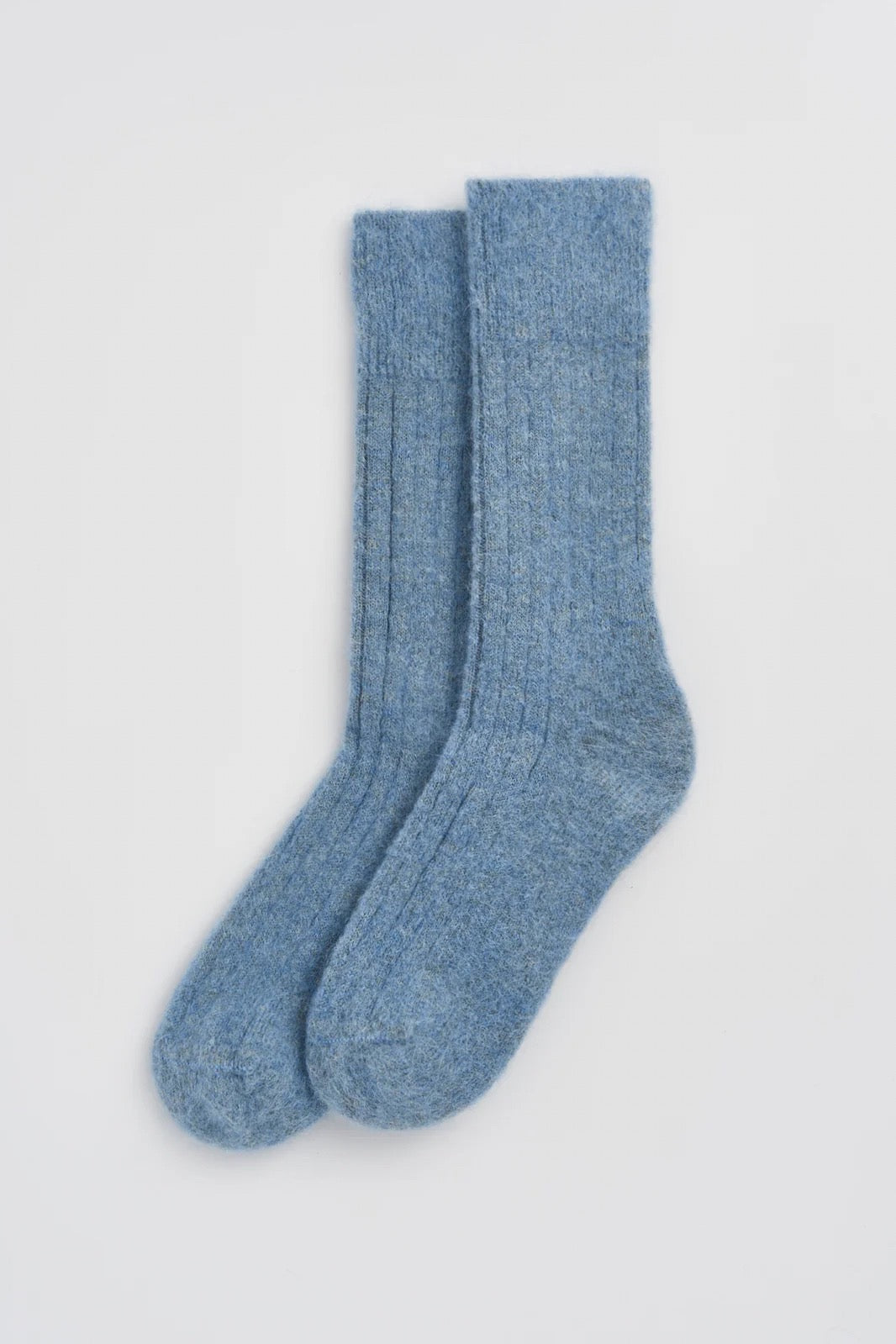 Pair of blue socks on a white background.