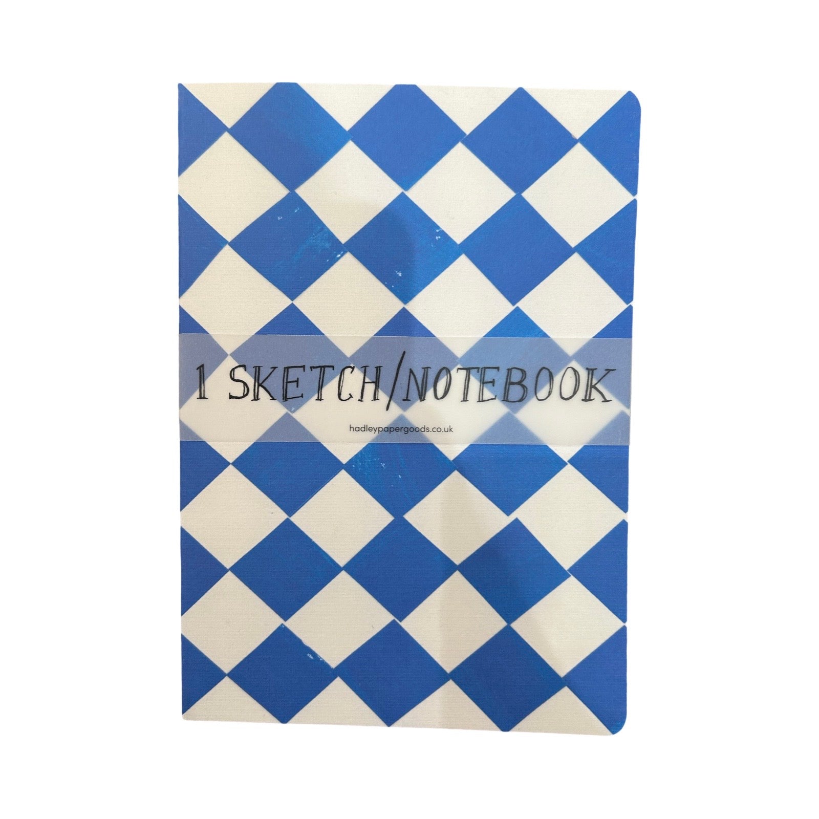 An A5 blue and white checked notebook, with a packaging band.