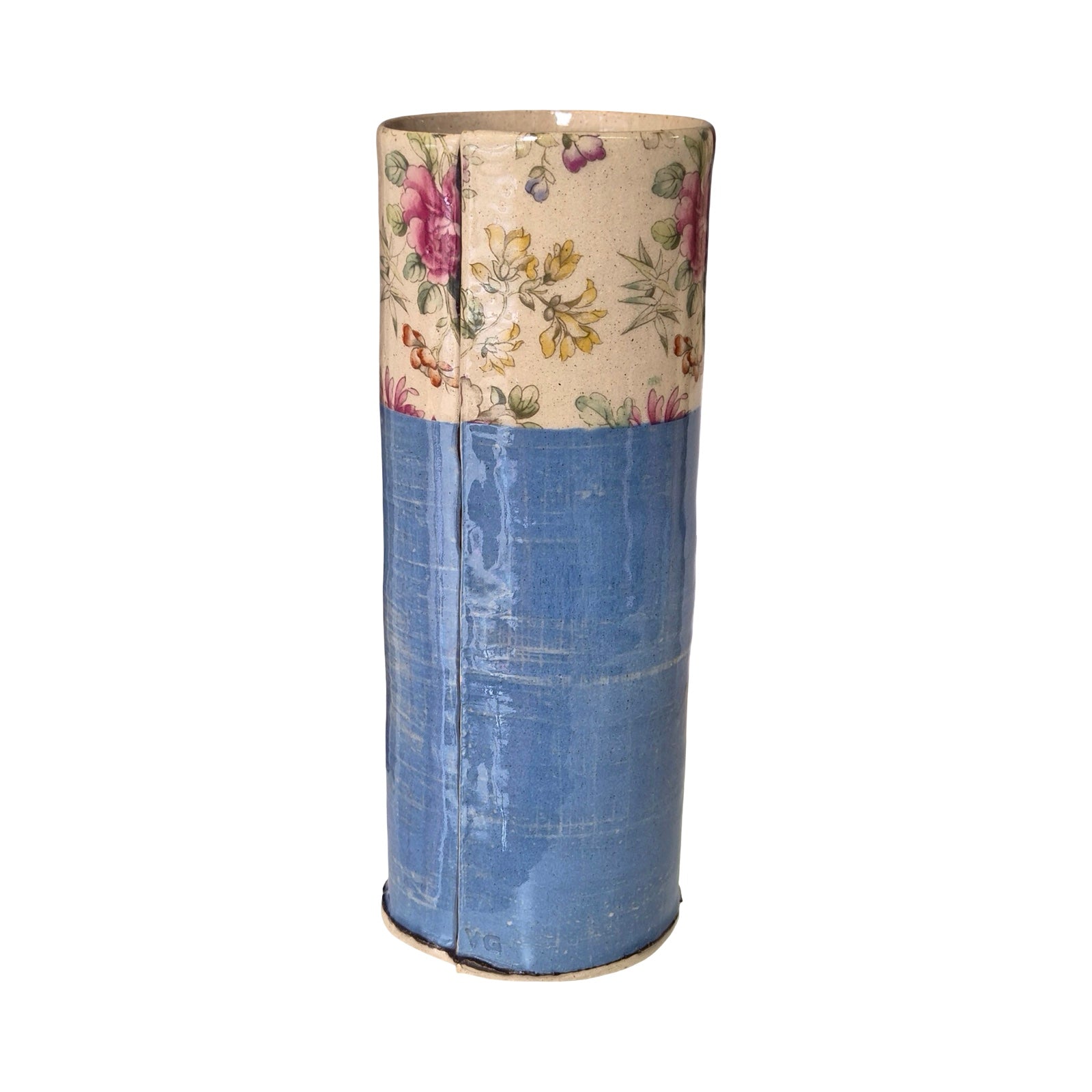 Cylindrical vase with floral top section and blue bottom section on a white background.