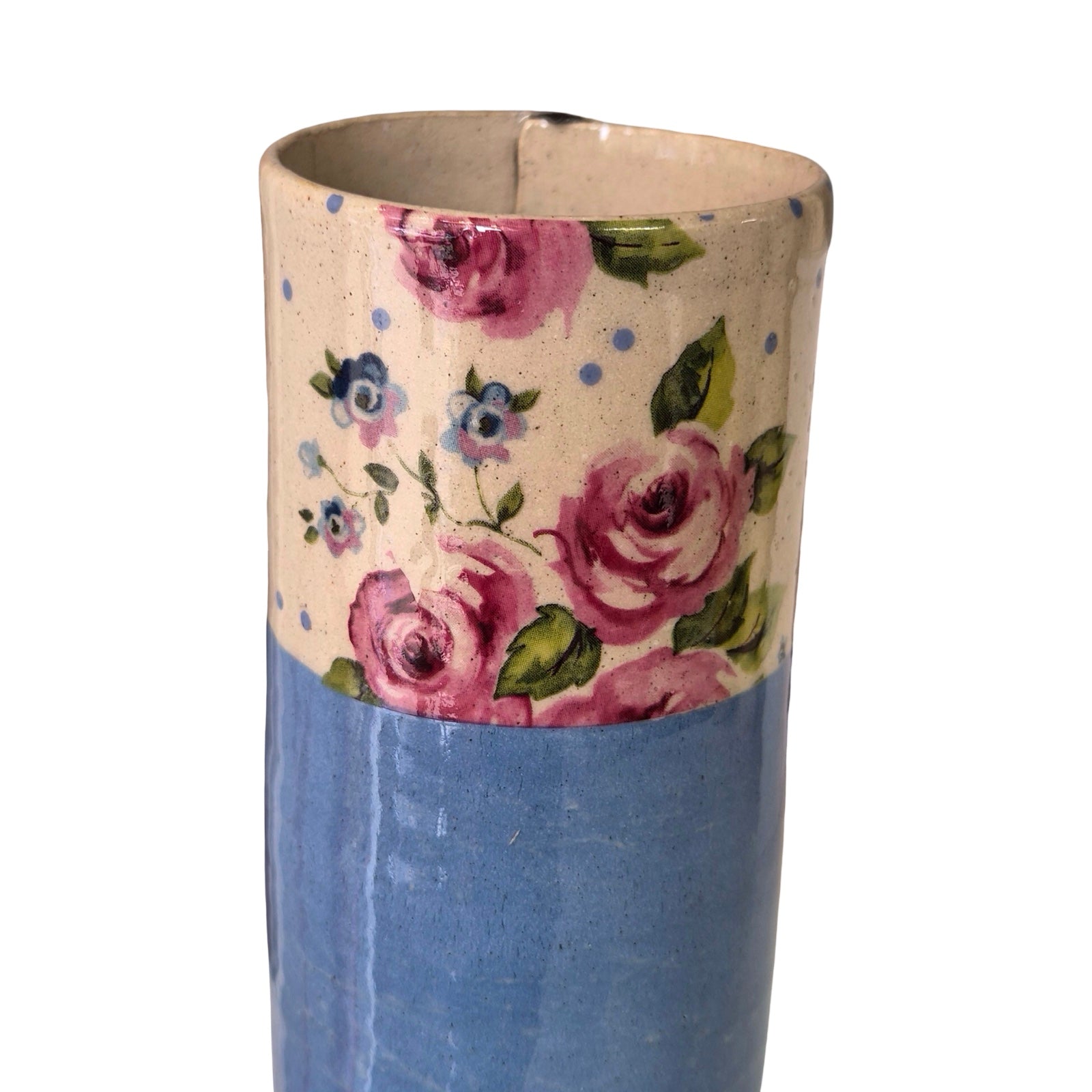 Cylindrical vase with floral design on a white background.