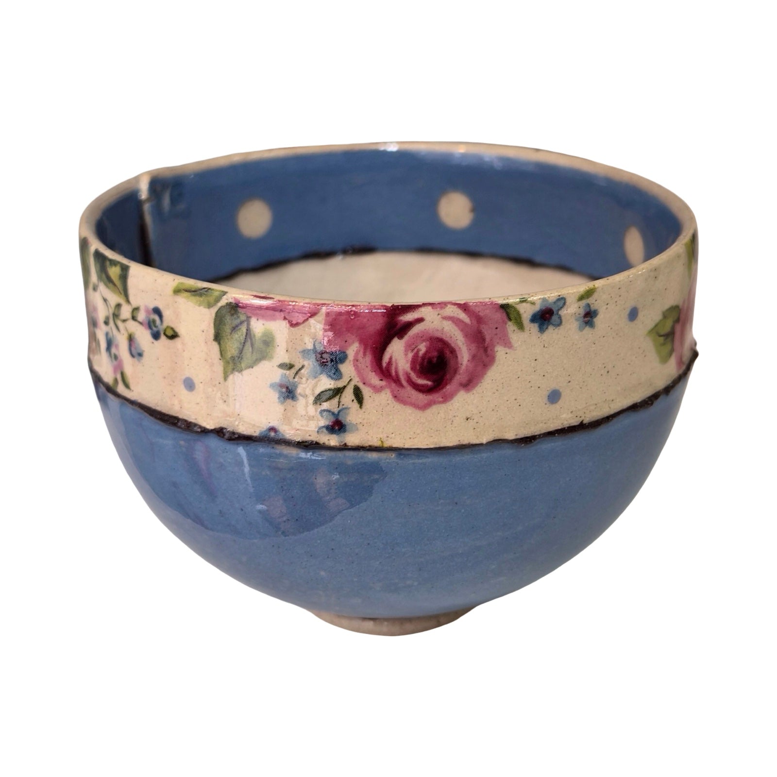 Blue ceramic bowl with floral band on a white background.
